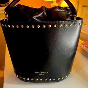 Anna Paola Black gold studded bucket bag.